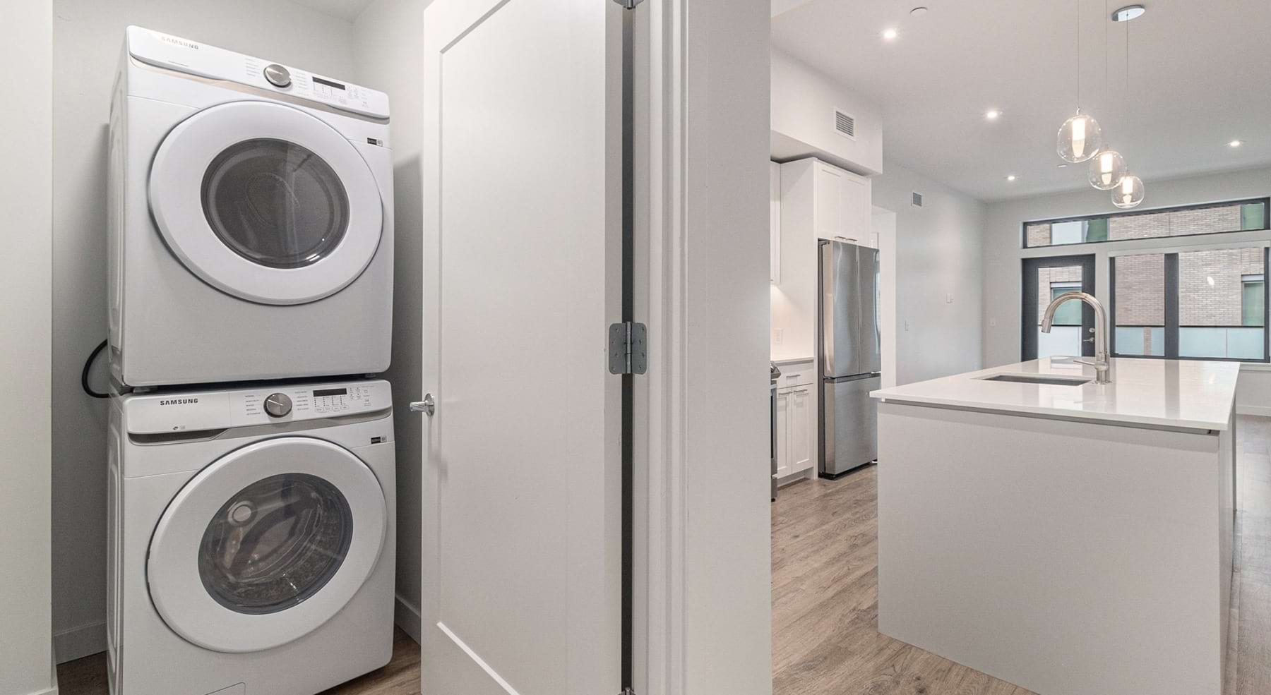 a spacious laundry closet near a kitchen