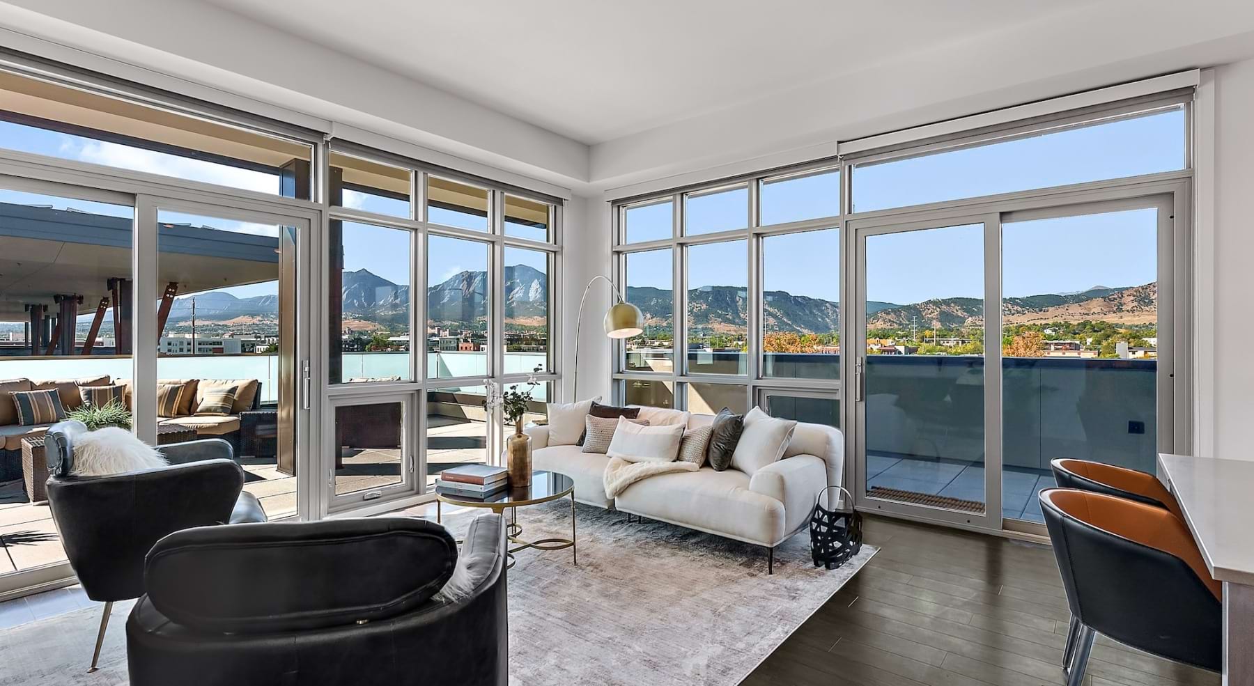 a well-lit clubroom with a scenic view