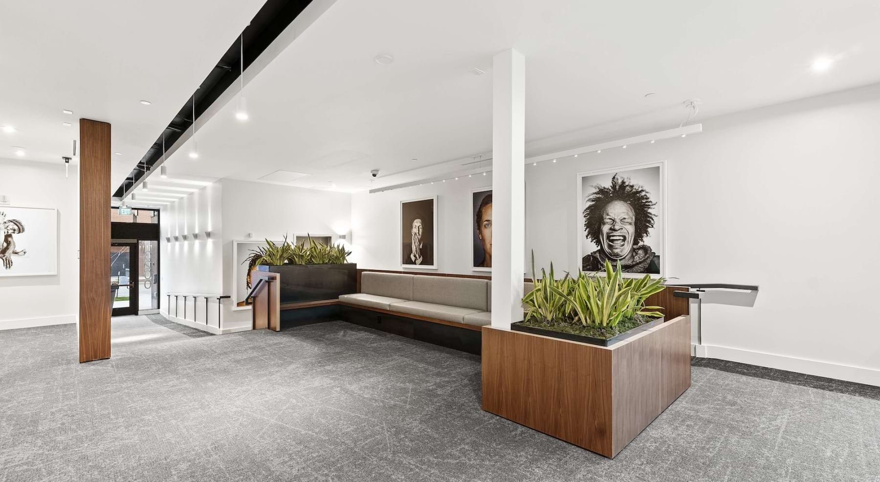 a large empty room with a seating area