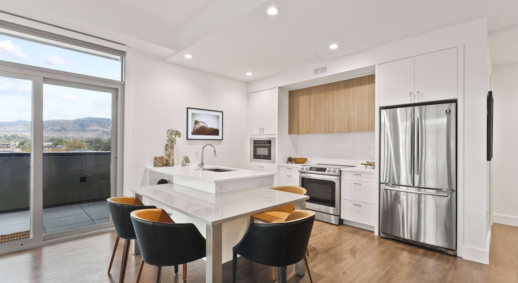 Well-lit kitchen with ample counter space and natural light