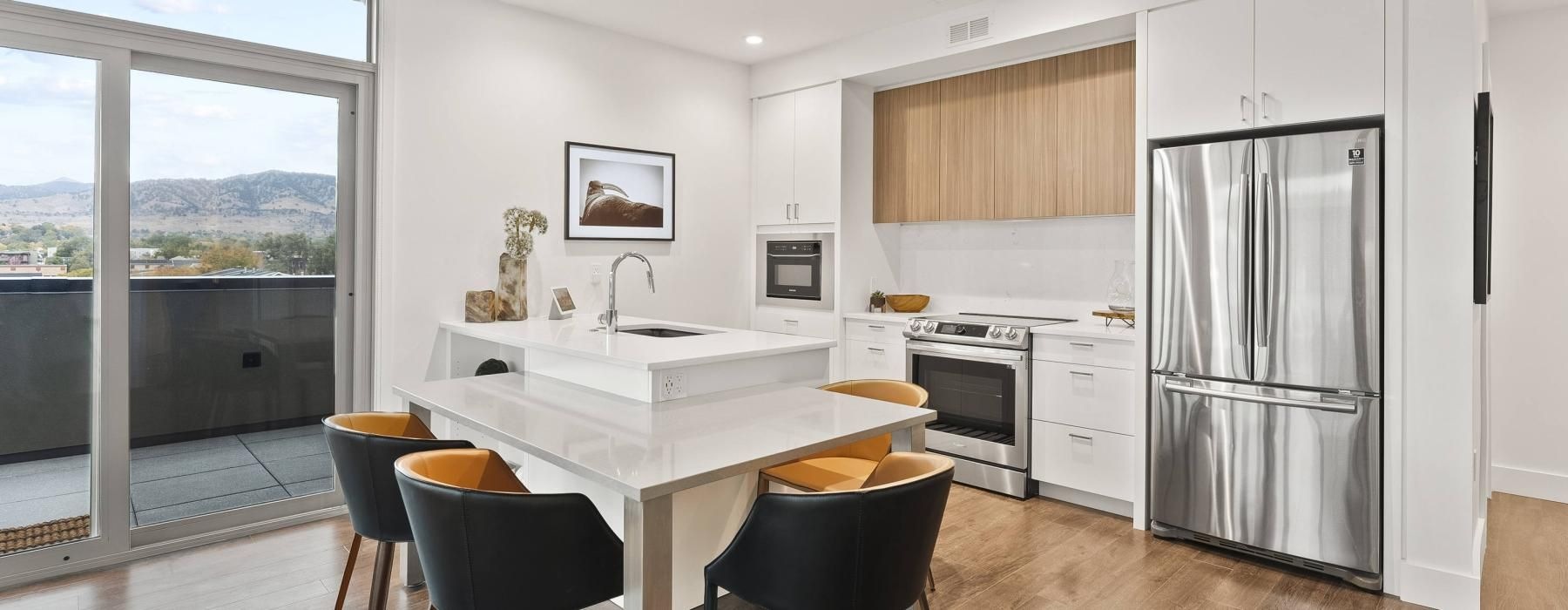 a kitchen with a table and chairs