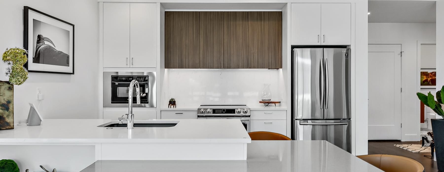 a kitchen with white cabinets